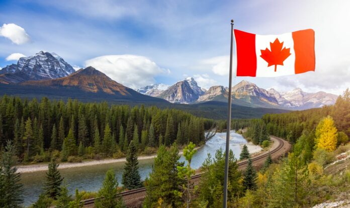 Canadian National Flag composite with Rocky Mountain Landscape in background.